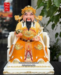 Tượng Thần Tiền như ý thỏi vàng áo gấm cam bằng bột đá