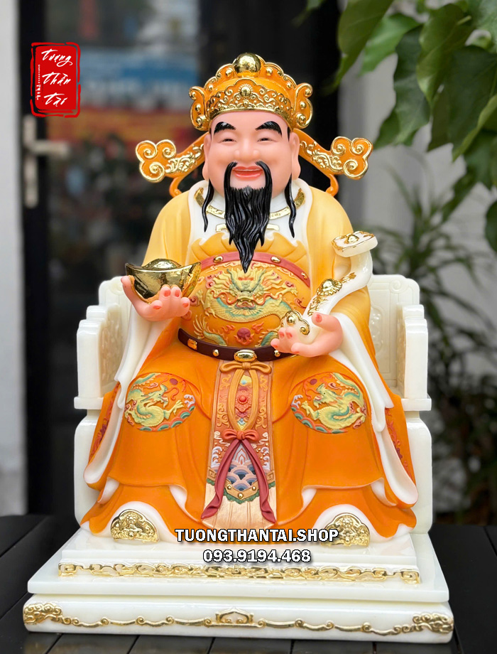 Tượng Thần Tiền như ý thỏi vàng áo gấm cam bằng bột đá
