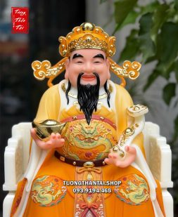 Tượng Thần Tiền như ý thỏi vàng áo gấm cam bằng bột đá đẹp nhất tại tphcm