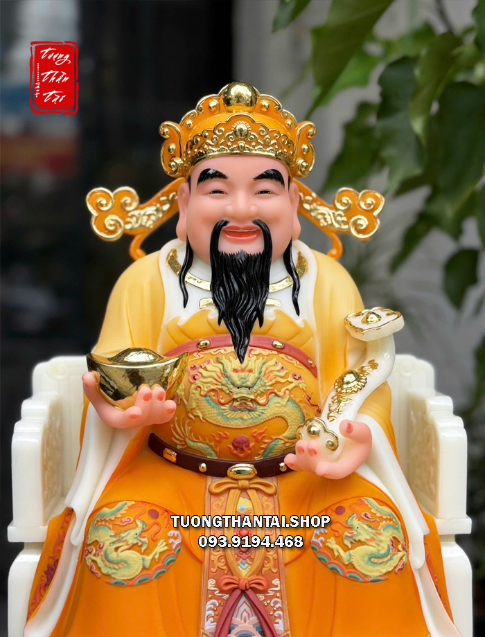 Tượng Thần Tiền như ý thỏi vàng áo gấm cam bằng bột đá đẹp nhất tại tphcm