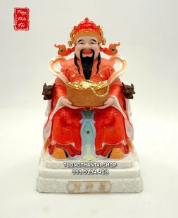 Tượng Thần Tiền ôm hũ vàng ngồi ghế rồng gấm đỏ