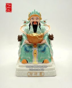Tượng Thần Tiền ôm hũ vàng ngồi ghế tay rồng y áo xanh ngọc